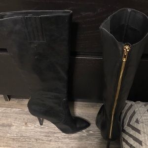 Black calf stiletto boots with pointed toe.